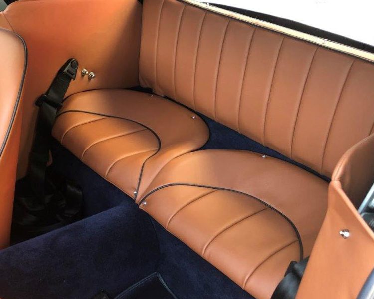 Austin Healey BJ7 trimmed with New Tan Leather Panels and Seats with Dark Blue Piping and Dark Blue Wool Carpet