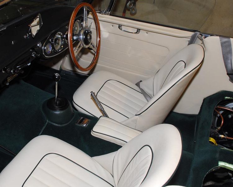 Austin Healey BJ7 trimmed with Parchment Vinyl Panels, LeatherFaced Seats with Dark Green Piping and Dark Green Wool Carpet