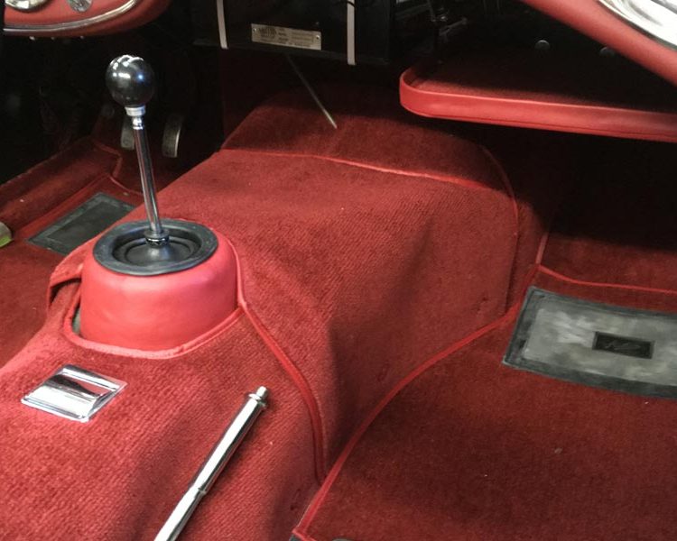 Austin Healey BJ7 trimmed with Cherry Red Vinyl Underdash Parcel Tray and Bright Red Nylon Carpet