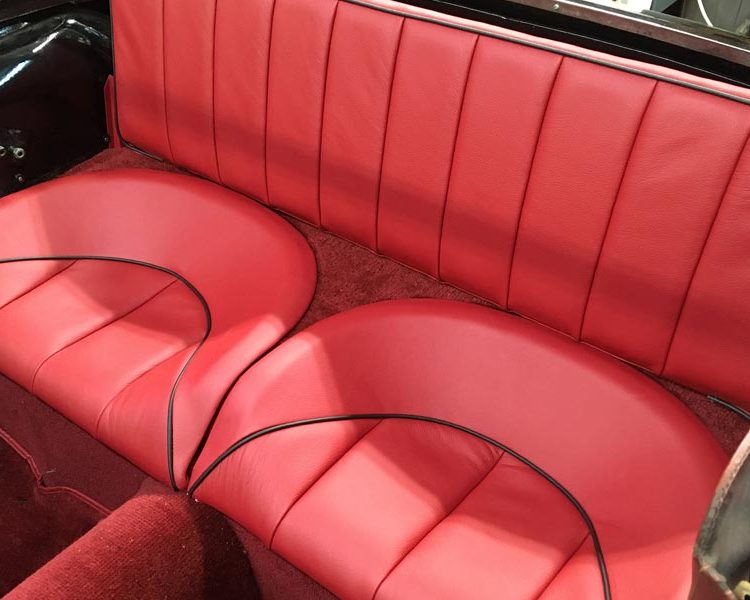 Austin Healey BJ7 trimmed with Cherry Red LeatherFaced Rear Seat Covers with Black Piping and Bright Red Nylon Carpet
