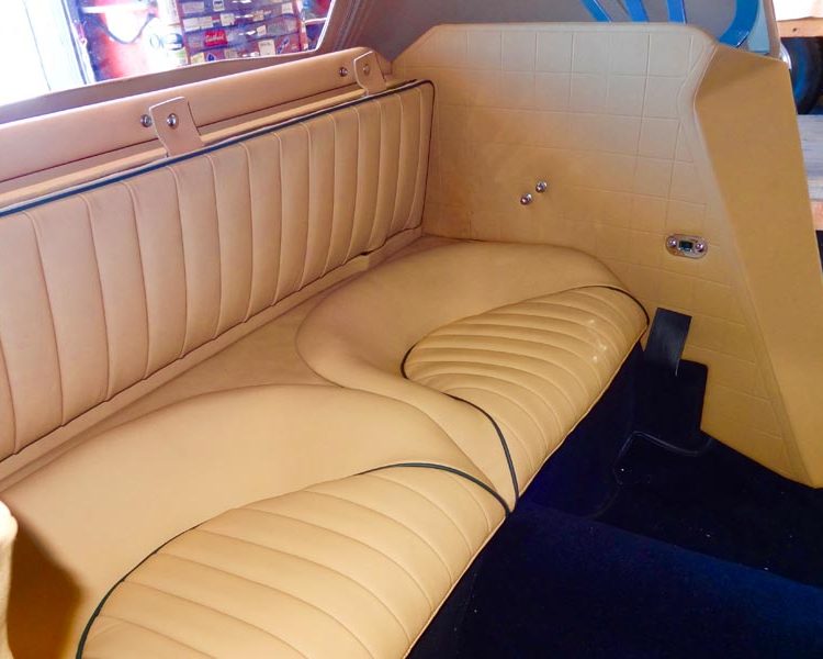 Austin Healey BJ8 trimmed with Biscuit Light Tan Vinyl Panels, Full Leather Rear Seats with BRG Piping and Black Wool Carpet