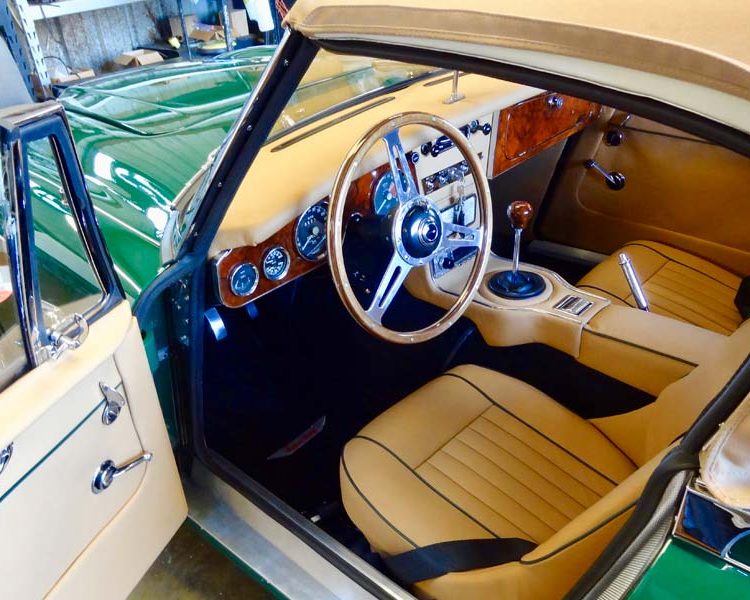 Austin Healey BJ8 trimmed with Biscuit Light Tan Smooth Leather Panels and Seats with BRG Piping and Black Wool Carpet