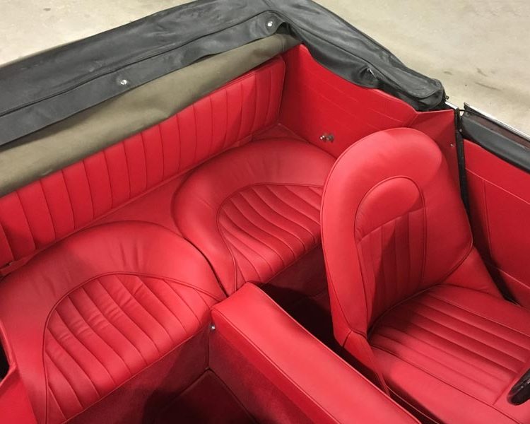 Austin Healey BJ8 trimmed with Bright Red Vinyl Panels, Full Leather Seats and Armrest with Bright Red Wool Carpet