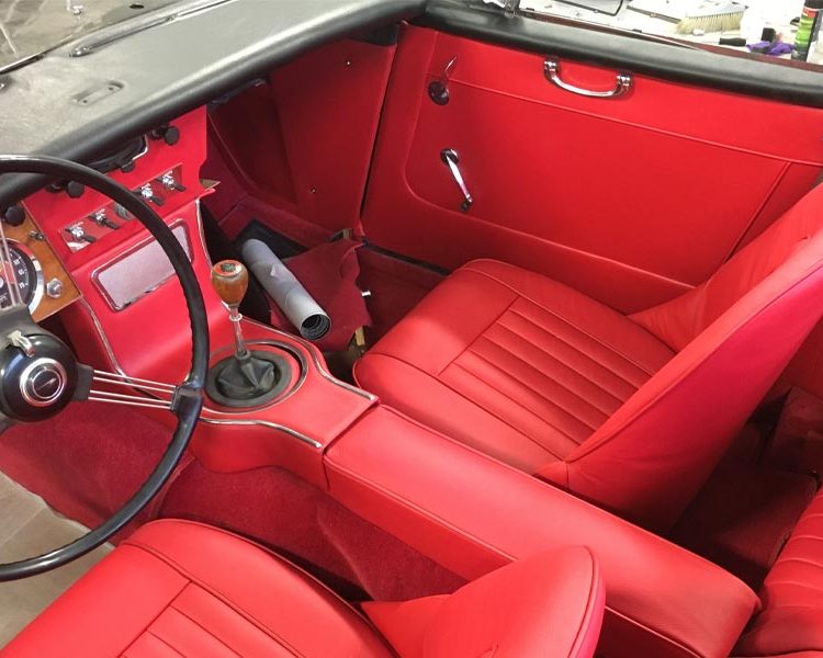 Austin Healey BJ8 trimmed with Bright Red Vinyl Panels, Full Leather Seats and Armrest with Bright Red Wool Carpet
