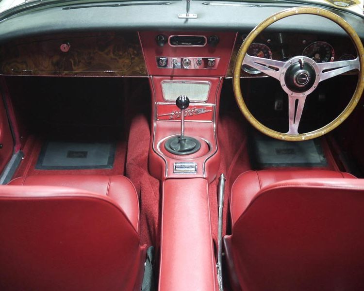 Austin Healey BJ8 trimmed with Cherry Red Vinyl Panels, Seats and Centre Cushion Armrest with Red Karvel Carpet