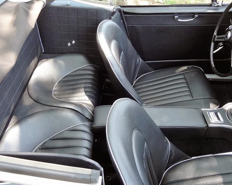 Austin Healey BJ8 trimmed with Black Vinyl Panels, Seats and Armrest with Chrome Piping and Black Wool Carpet