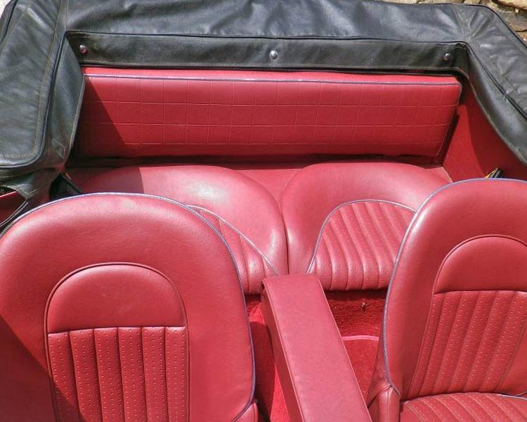 Austin Healey BJ8 trimmed with Matador Red Vinyl Panels, Seats and Centre Cushion Armrest with Chrome Piping