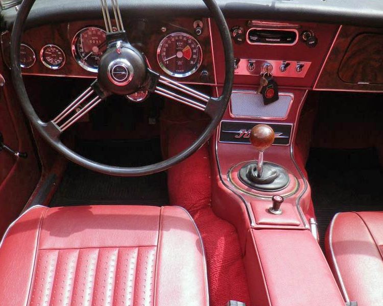Austin Healey BJ8 trimmed with Matador Red Vinyl Panels, Seats and Centre Cushion Armrest with Chrome Piping