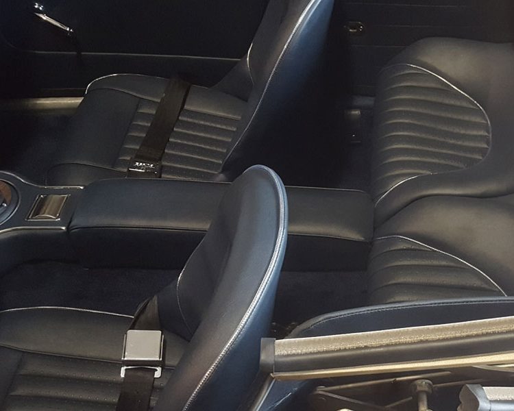 Austin Healey BJ8 trimmed with Dark Blue Vinyl Panels, Seats and Armrest with Chrome Piping and Dark Blue Wool Carpet