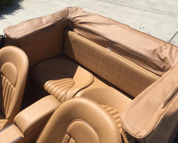 Austin Healey BJ8 trimmed with Biscuit Light Tan Vinyl Panels, Seats and Armrest. Hood Frame Cover in Sand PVC.