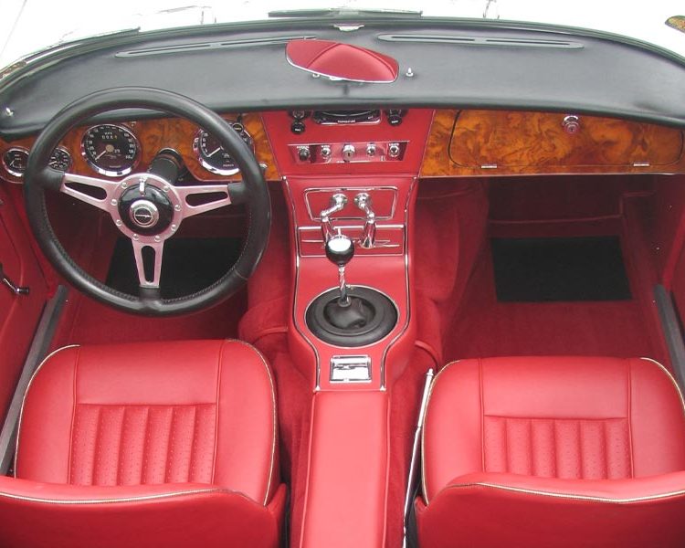 Austin Healey BJ8 trimmed with Cherry Red Vinyl Panels, Seats and Armrest with Chrome Piping and Bright Red Nylon Carpet
