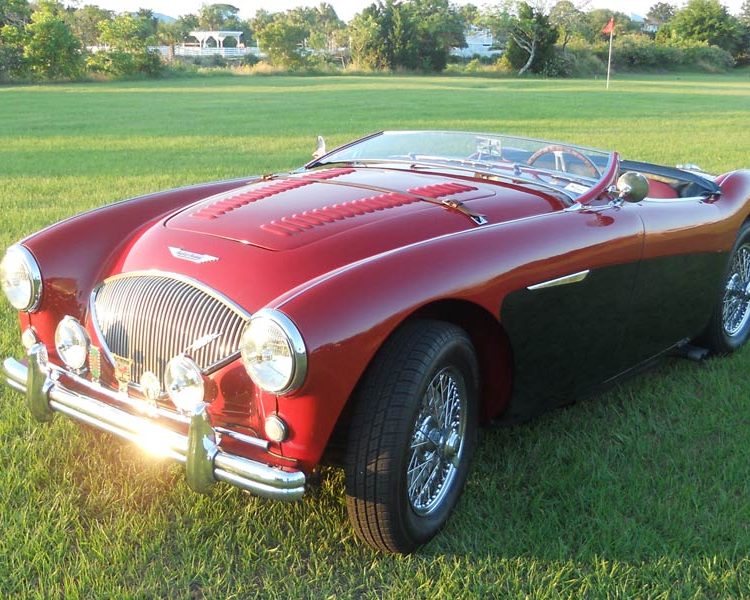 Austin Healey BN2 trimmed with Cherry Red Vinyl Panels and LeatherFaced Seats in Cherry Red with Black Piping