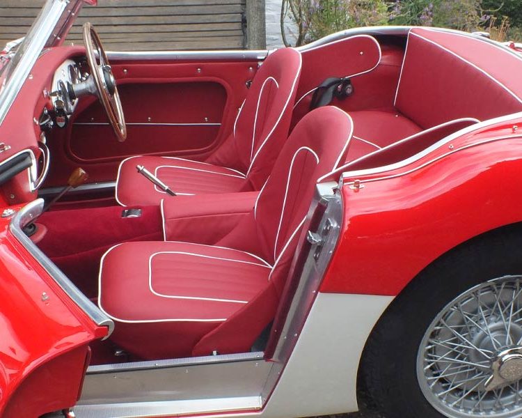 Austin Healey BN4 trimmed with Cherry Red Vinyl Panels, Full Leather Seats with White Piping and Red Wool Carpet