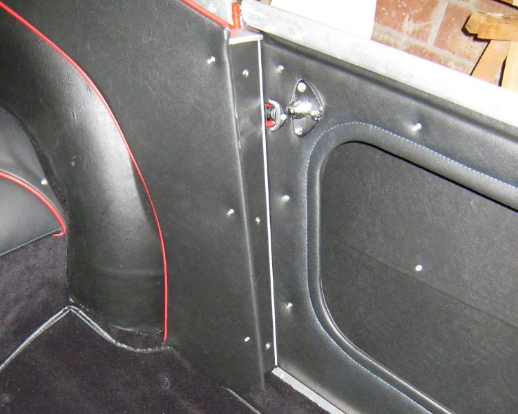 Austin Healey BN4 trimmed with Black Vinyl Panels with Cherry Red Piping and Black Wool Carpet