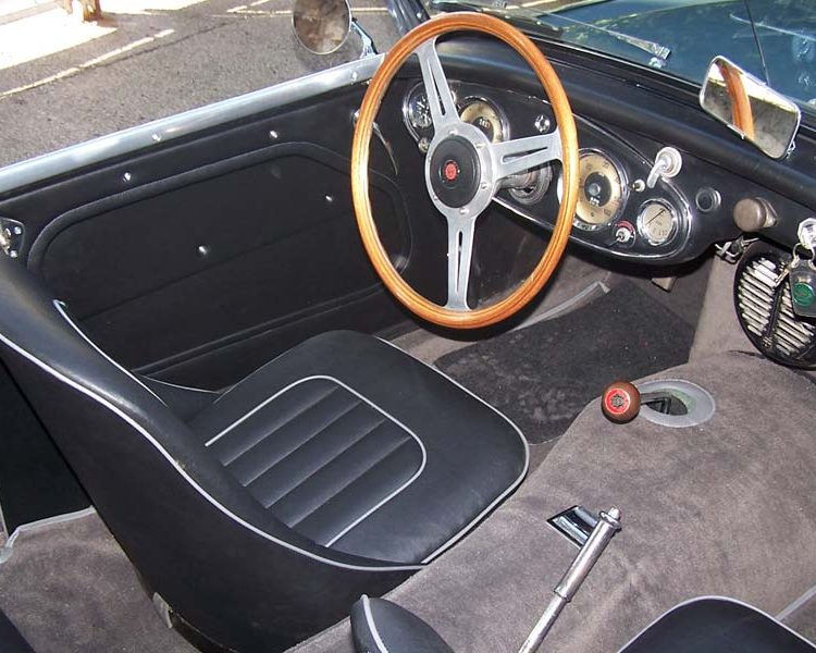 Austin Healey BN4 trimmed with Black Vinyl Panels and Seats with Saville Grey Piping and Dark Grey Nylon Carpet