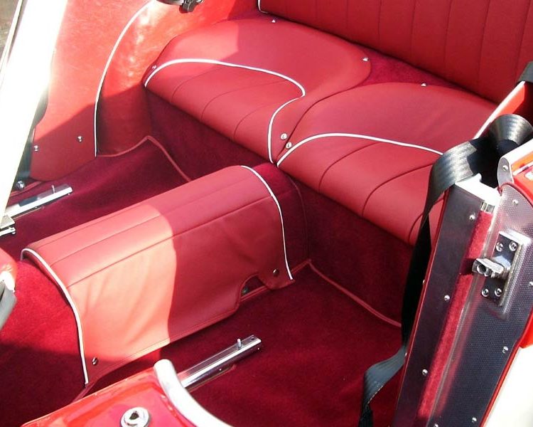 Austin Healey BN4 trimmed with Cherry Red Vinyl Panels, Full Leather Seats with White Piping and Red Wool Carpet