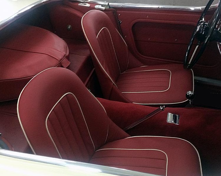 Austin Healey BN7 trimmed with Matador Red Vinyl Panels and LeatherFaced Seats with White Piping. Dark Red Nylon Carpet.