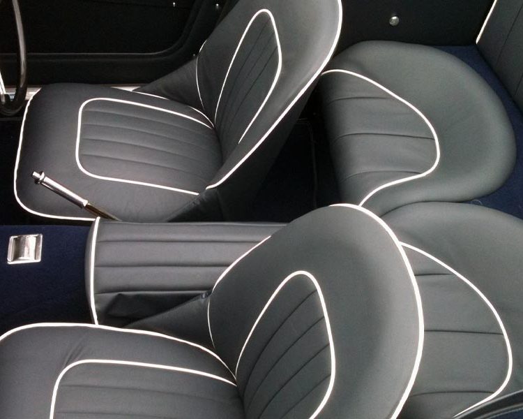 Austin Healey BT7 trimmed with Dark Blue Vinyl Panels, LeatherFaced Seats with White Piping and Dark Blue Wool Carpet