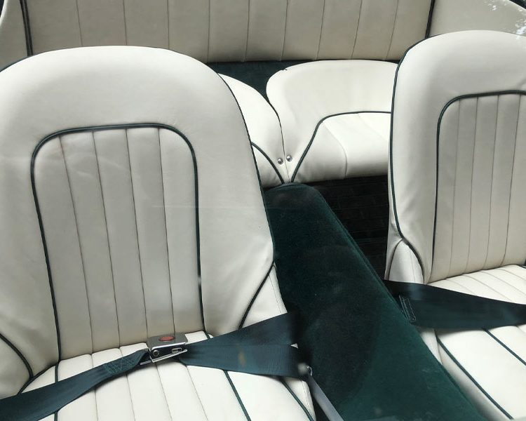 Austin Healey BT7 trimmed with Ivory Vinyl Panels, LeatherFaced Seats with BRG Piping and Dark Green Wool Carpet