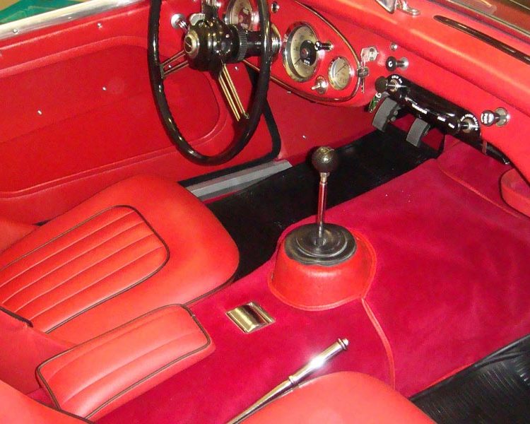 Austin Healey BT7 trimmed with Cherry Red Vinyl Panels, LeatherFaced Seats with Black Piping and Red Wool Carpet
