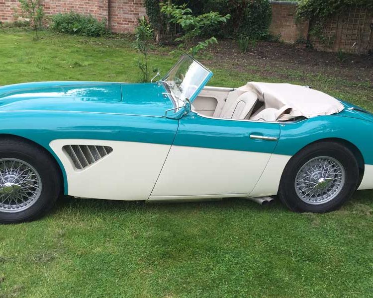 Austin Healey BT7 trimmed with Ivory Leather Panels and Seats with BRG Piping. Tonneau Cover in Off-White PVC Hooding.