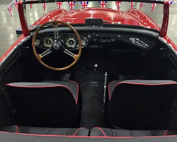 Austin Healey BT7 trimmed with Black Vinyl Panels, LeatherFaced Seats with Bright Red Piping and Black Carpet