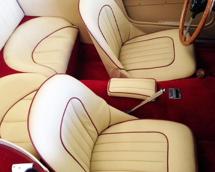 Austin Healey BT7 trimmed with Magnolia Vinyl Panels, LeatherFaced Seats with Matador Red Piping and Red Wool Carpet