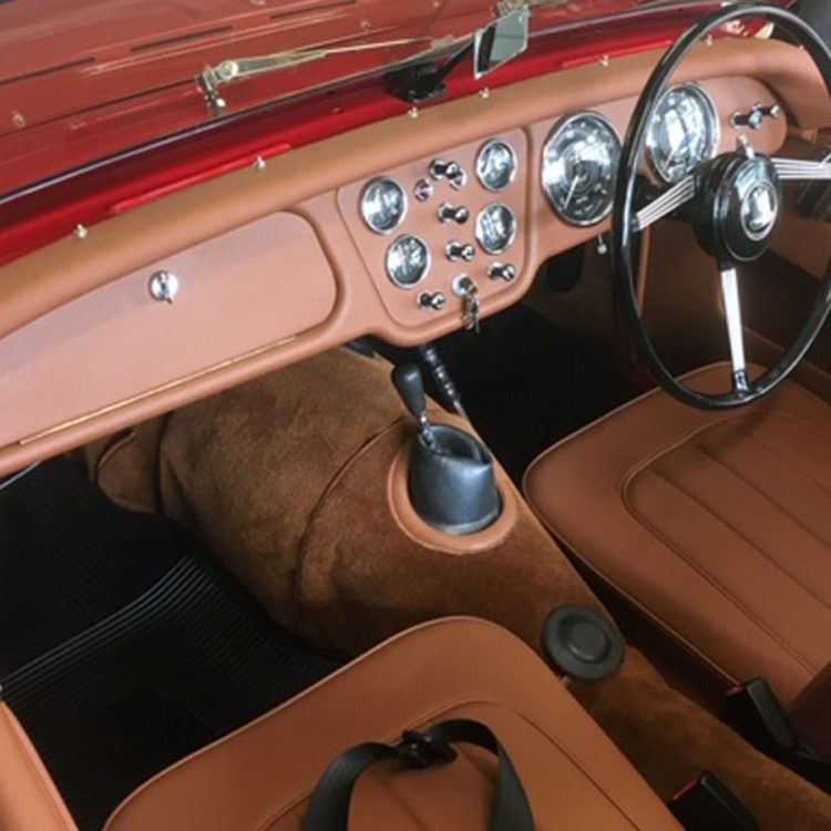 Triumph TR2 fitted with New Tan Leather Cappings, LeatherFaced Seats, Vinyl Dash Board and Wool Carpets.