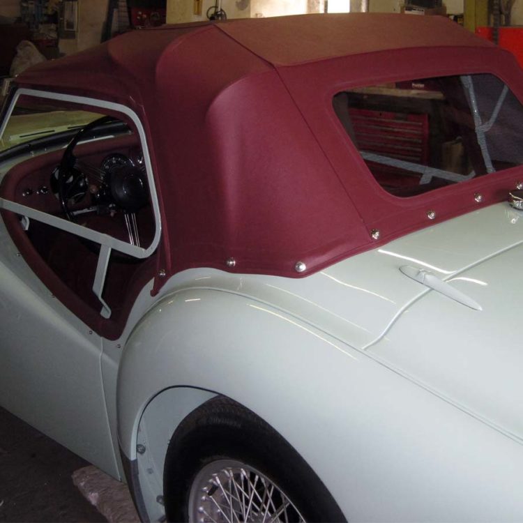 Triumph TR2 fitted with Maroon PVC Everflex Soft Top Convertible Hood; early style with one window.