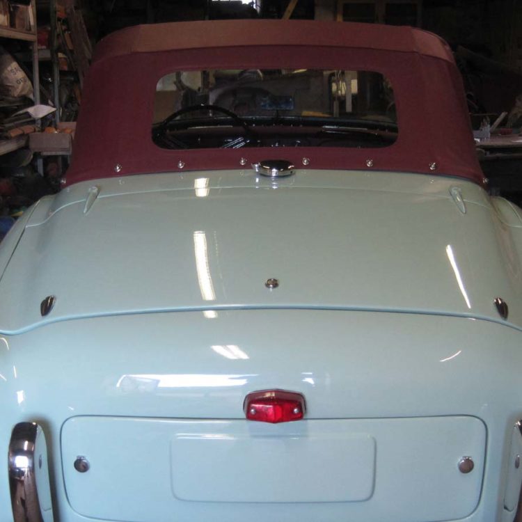 Triumph TR2 fitted with Maroon PVC Everflex Soft Top Convertible Hood; early style with one window.