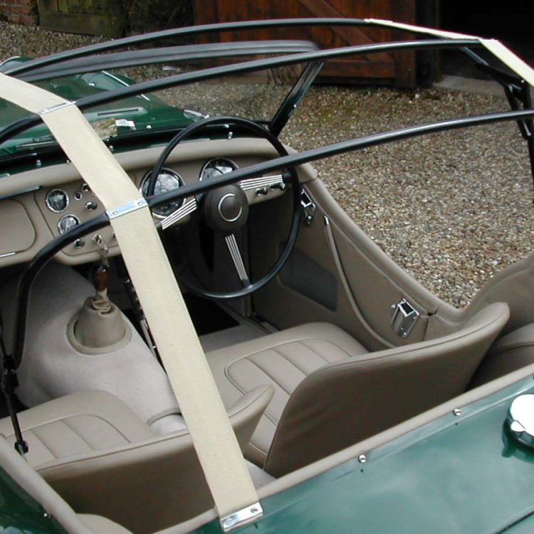Triumph TR2 fitted with Stone LeatherFaced Front Seat Covers, and Camel Wool Carpets, and Beige Hood Webbing.