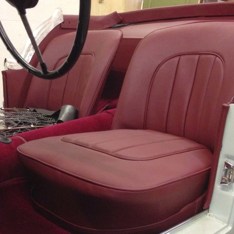 Triumph TR2 fitted with Maroon Vinyl Seat Covers, Draught Excluder Furflex, and Wool Carpets.