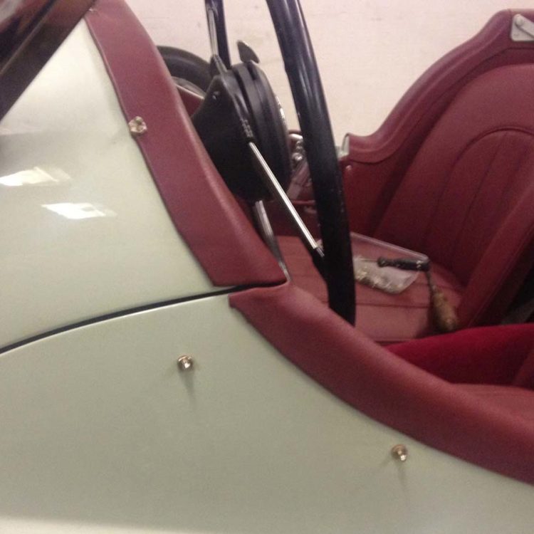 Triumph TR2 fitted with Maroon Vinyl Cappings & Front Seat Covers.
