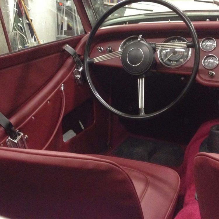 Triumph TR2 fitted with Maroon Vinyl Interior Trim Panels, Seat Covers and Wool Carpets.