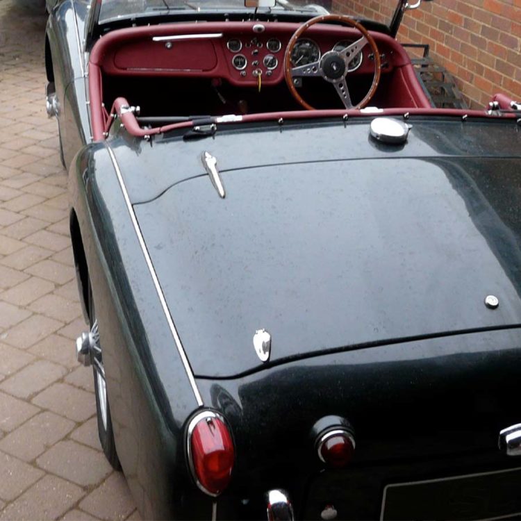 Triumph TR2 fitted with Matador Red Vinyl Hood Frame Cover, Dash Facia Panel, and Leather Cockpit Cappings.