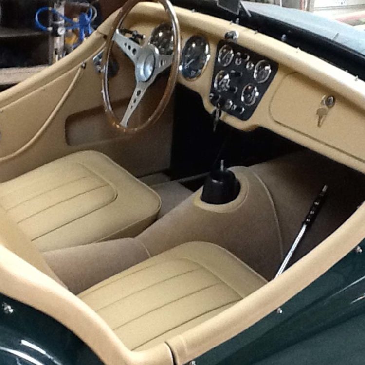 Triumph TR2 fitted with Biscuit Light Tan Leather Trim Panels and Seat Covers, and a Cinnamon Wool Carpet Set.