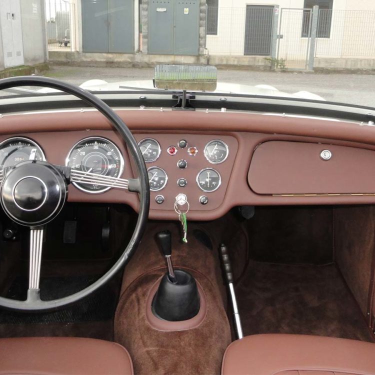 Triumph TR2 fitted with a Dark Brown Vinyl Dashboard Facia Panel, Leather Cappings, and Wool Carpets.