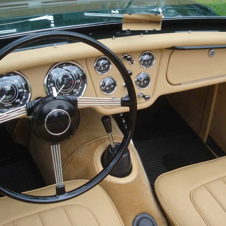 Triumph TR2 fitted with Biscuit Light Tan Leather Dash Board & Scuttle Capping, Door Panels, Seats and Palomino Wool Carpet.