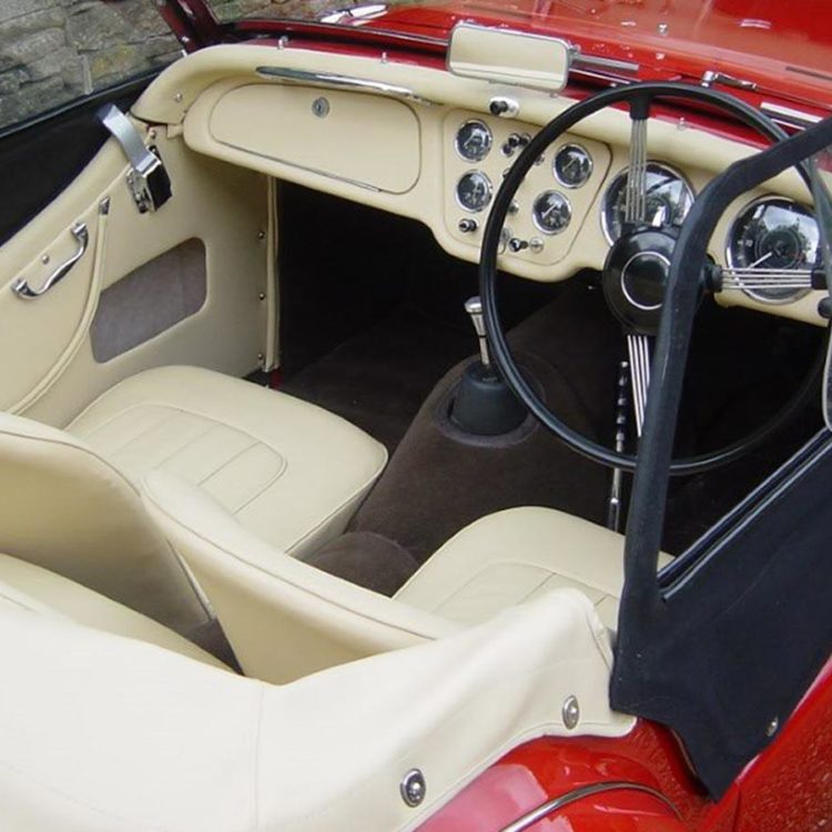 Triumph TR3 fitted with Magnolia Leather Seats, Leather Cappings; Vinyl Trim Panels and Hood Frame Cover, and Dark Brown Wool Carpets.