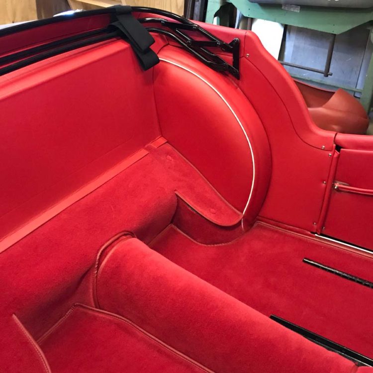Triumph TR3 fitted with Bright Red Vinyl Interior Trim Panels, with a Bright Red Wool Carpet Set.
