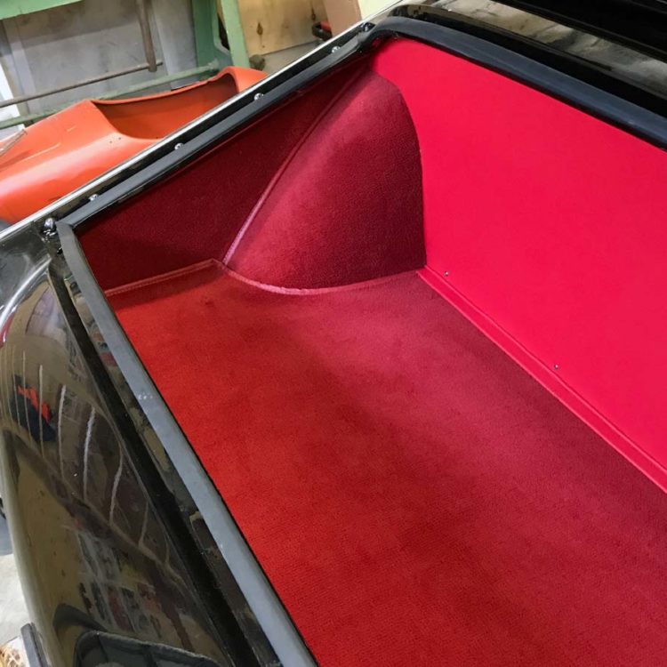 Triumph TR3 fitted with Bright Red Vinyl Boot Trunk Fuel Tank Board, with Red Nylon Carpets and Side Panels.