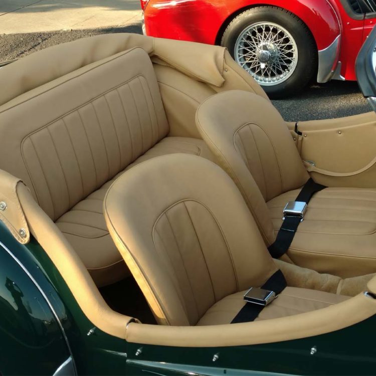 Triumph TR3 fitted with a Biscuit Light Tan Vinyl Hood Frame Cover and Interior Trim Panels; Leather Cappings, and LeatherFaced Front + Rear Seats.