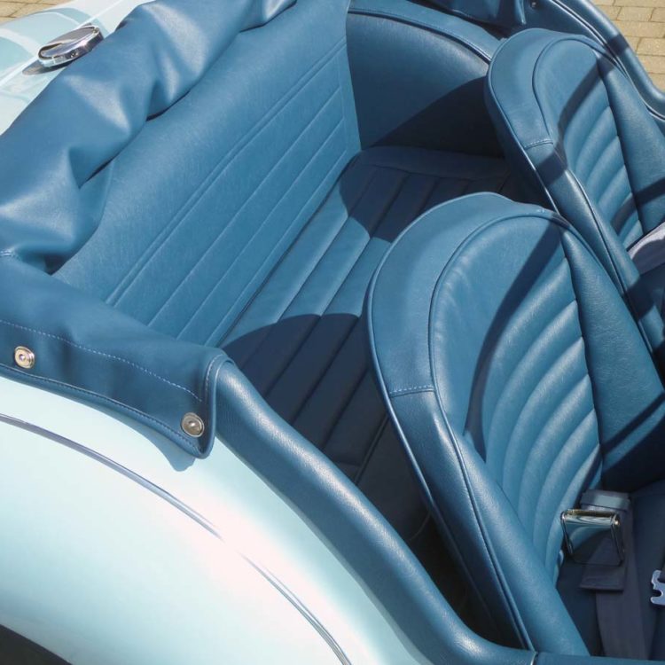 Triumph TR3A/B fitted with Midnight Blue Vinyl Trim Panels, Front & Rear Seat Covers, and Hood Frame Cover.