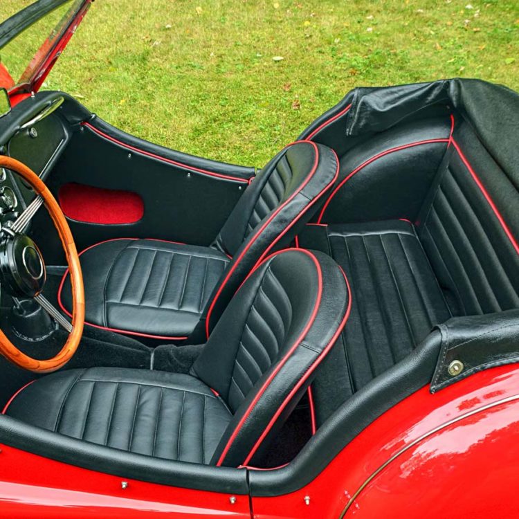 Triumph TR3A/B fitted with Black Vinyl Trim Panels, Leather Cappings, LeatherFaced Front & Rear Seats, and a Black Wool Carpet Set.