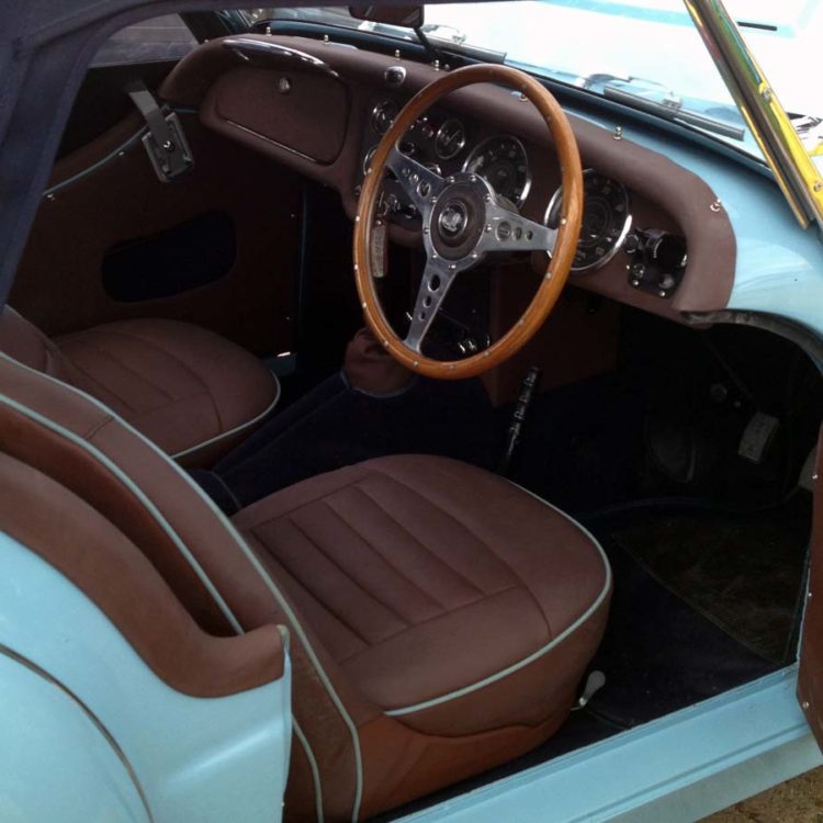 Triumph TR3A/B fitted with Dark Brown Leather Front Seat Covers, Interior Trim Panels, with a Dark Blue Wool Carpet Set.