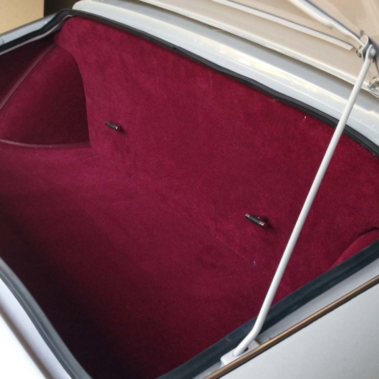 Triumph TR3A/B fitted with Maroon Wool Boot Trunk Mat, Side Panels, and Trimmed Petrol Fuel Tank Board.
