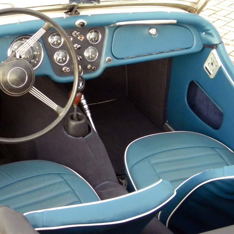 Triumph TR3A fitted with Midnight Blue Vinyl Interior Trim Panels, LeatherFaced Front Seats, and Dark Blue Nylon Carpets.