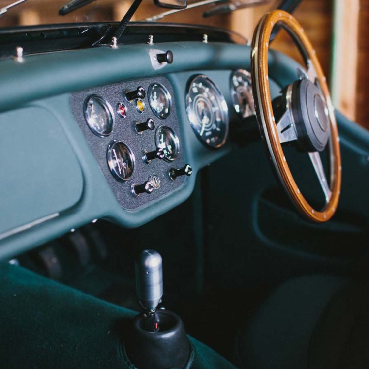 Triumph TR3A fitted with British Racing Green (BRG) Leather Dash Facia & Scuttle Capping, with Dark Green Wool Carpets.