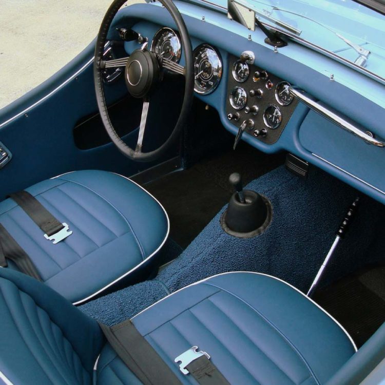 Triumph TR3A fitted with Midnight Blue Vinyl Trim Panels, Leather Cappings, and LeatherFaced Front Seat Covers.
