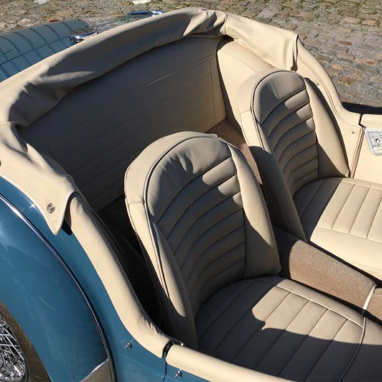 Triumph TR3A fitted with Sand Leather Interior Trim Panels, Seat Covers, Hood Frame Cover, and a Fawn Wool Carpet Set.